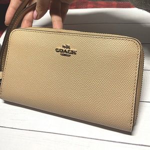 Coach wristlet wallet with phone holder in beige
